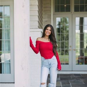 Red off the shoulder ribbed sweater